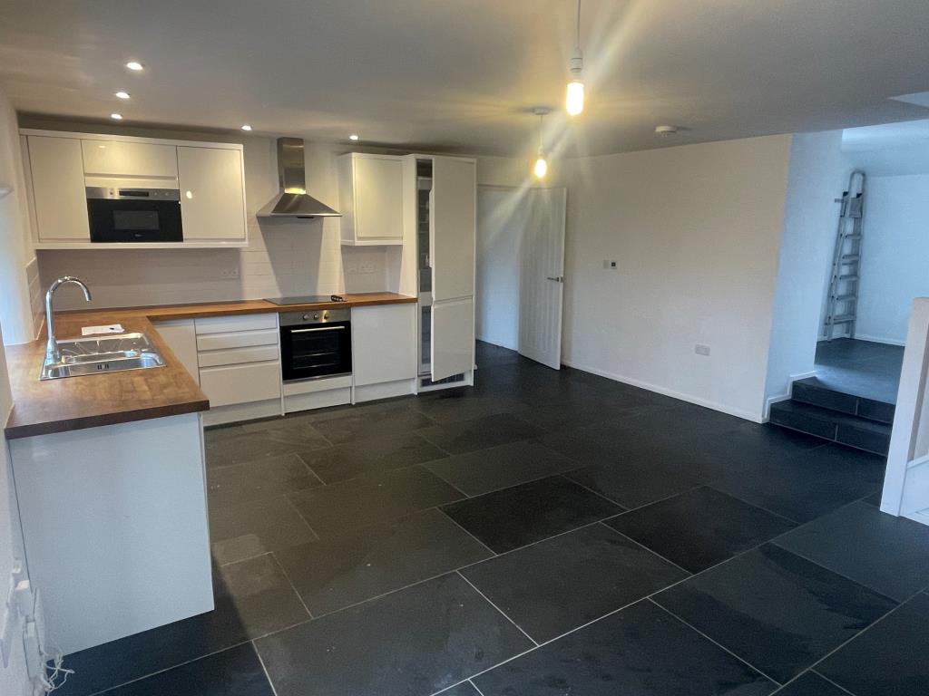 Lot: 60 - THREE-BEDROOM BARN CONVERSION - Open plan living/dining room with kitchen from different angle